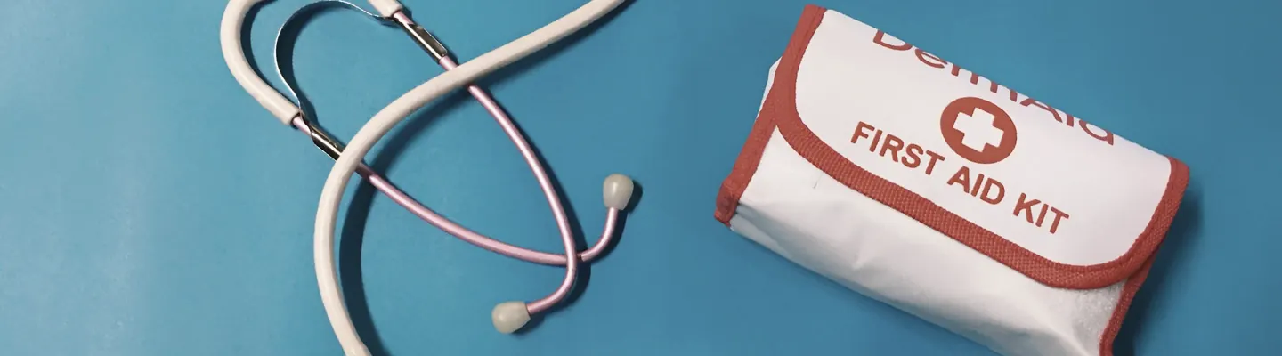a bag of pills, a stethoscope, and a first aid kit
